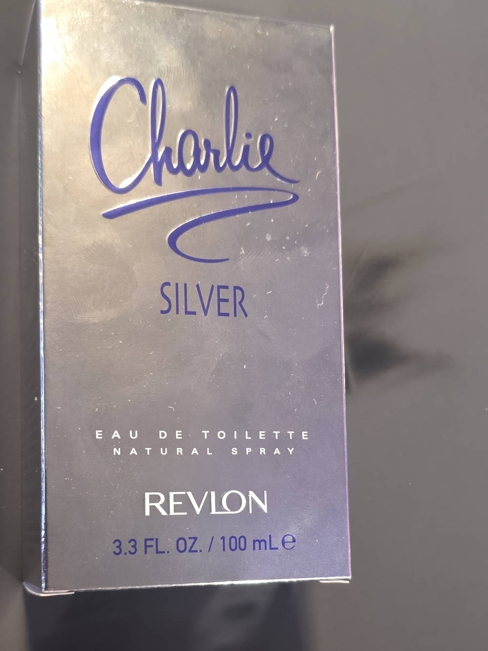 Revlon Silver Box with Blue Barcode Accents